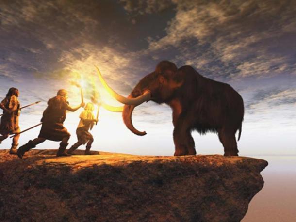 Prehistoric men hunting a young mammoth. (anibal / Adobe Stock)
