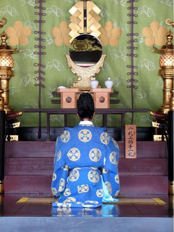 Priest in deep prayer at the Dazaifu Tenmagu Shrine in Fukuoka, Japan, 2007 