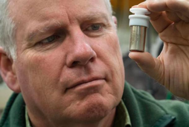 Professor Trevor Ireland from the ANU Research School of Earth Sciences holds a vial containing moon dust collected by Apollo 11 astronaut Neil Armstrong during his first walk on the Moon.  Since 1969, the ANU has played a critical role in the analysis of moon material. Image credit: Lannon Harley, ANU