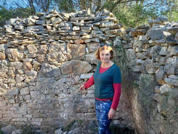Professor Katunarić Kirjakov's on Hvar island standing before walls built by the Romans, just inland from the underwater Roman villa her team found on the bottom of Carkvica Bay. (Mirko Crnčević / Total Croatia News)