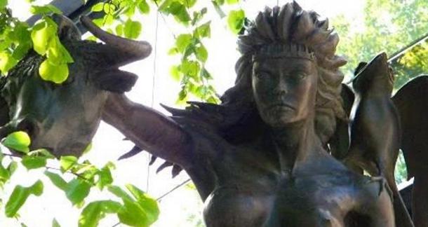 A statue of Queen Medb holding the head of a bull, seen in Beresford Place, Dublin, created by artist Patrick O'Reilly.