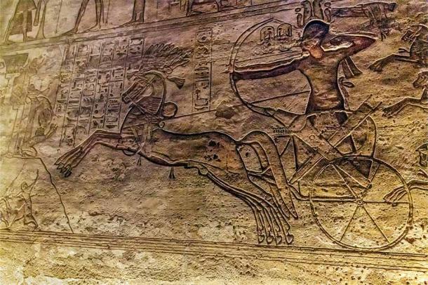Ramses II on his chariot shooting arrow, bas-relief, battle Kadesh, Abu Simbel – Egypy. (Tom / Adobe Stock)