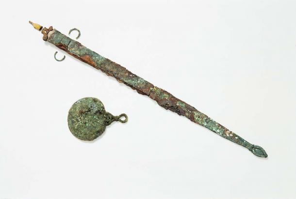 Recent DNA testing of the skeletal remains discovered on the Isles of Scilly, along with artifacts buried within the tomb such as this Iron Age sword, are forcing archaeologists to abandon their gender stereotypes. (Historic England Archive)