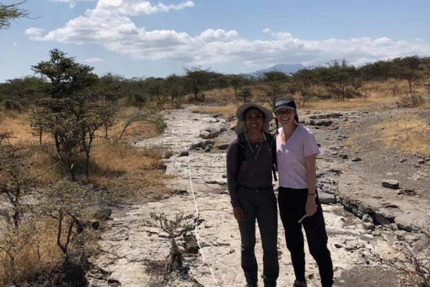 Research team members, Anjali Prabhat and Catherine Miller survey Laetoli Site A to identify the location of the bipedal footprints. (Jeremy DeSilva / Dartmouth College)