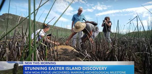 Researchers inspect the new-found Moai in the dry lake bed on Rapa Nui. (GMA/YouTube Screenshot)