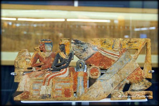 Richly colored fragments of a Sedan Chair show the deified Queen Ahmose-Nefertari seated alongside her deified son Amenhotep I. Museo Egizio, Turin, Italy.