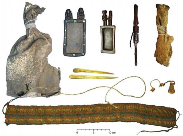 Ritual bundle with leather bag, carved wooden snuff tablets and snuff tube with human hair braids, pouch made of three fox snouts, camelid bone spatulas, colorful textile headband and wool and fiber strings. (Photos courtesy of Juan Albarracín-Jordán and José Capriles.)