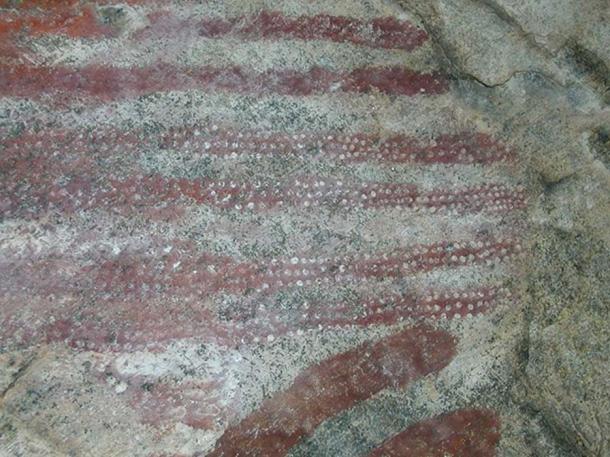 Rock art of red pigment (Photo by UNESCO)