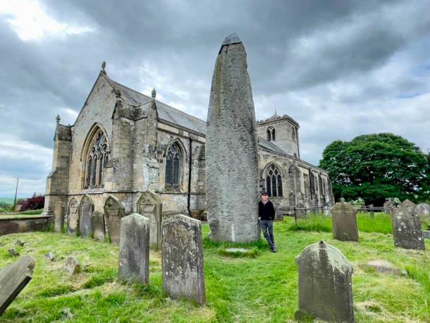 The Rudstone monolith and church. The Rudston Monolith at over 25 feet (7.6 m) is the tallest megalith in the United Kingdom. (Sacredsites.com)