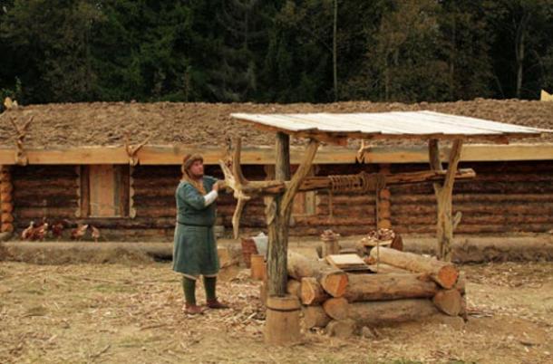 The ‘Russian Hermit’ collecting well water.