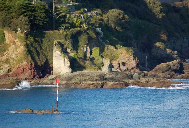 Salcombe Castle with its red rocks, which may have been thought to have been stained red by giants' blood