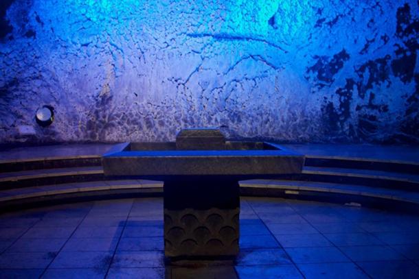 Salt alter with waterfall behind it.