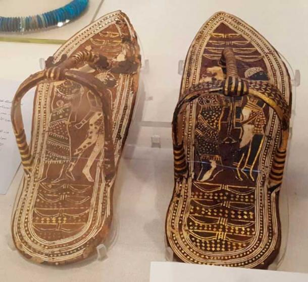 Sandals of Tutankhamun, showing foreigners alongside eight bows, with the ninth bow being represented by the sandal strap itself. Thus, the king walked on eighteen symbolic enemies. Now in the Egyptian Museum, Cairo. (Ovedc, CC BY-SA 4.0)