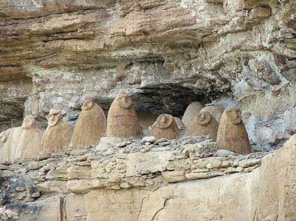 Sarcophagi on a cliff face, Chachapoyas, Amazonas, Peru. 