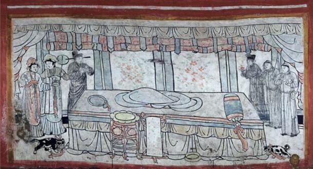 Scene depicting an empty bed with two pets on either side as well as male and female attendants (Chinese Cultural Relics photo)
