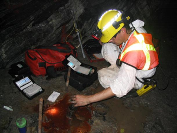 Scientist testing the world’s oldest pool of water (Photo by Barbara Sherwood Lollar)