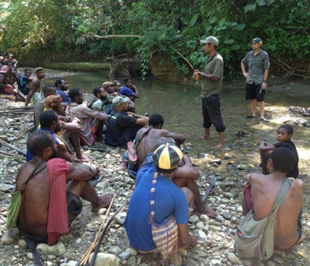 Scientists explaining their work to people who live near Aitape, Papua New Guinea, today.