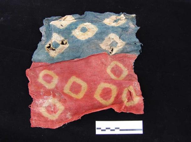 Some beautiful textiles were buried with the people in the funerary pits, preserved due to Peru’s dry climate. Image: Maria Cecilia Lozada