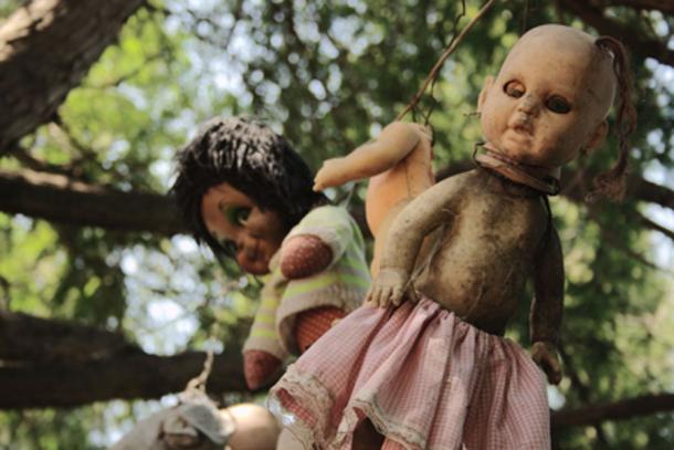 Some of the dolls from Santana Barrera's chinampa – the Island of Dolls in Mexico. Photo source: FlickreviewR / CC BY-SA 2.0.