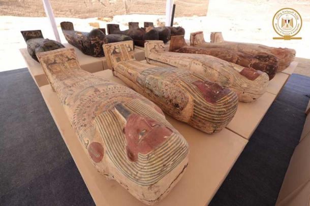 Some of the 250 mummy sarcophagi unearthed in Saqqara south of Cairo. The ancient papyrus was discovered within one of the caskets. (Ministry of Tourism and Antiquities)