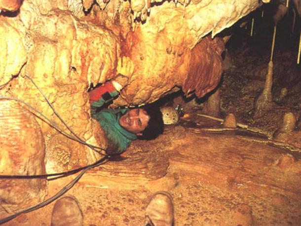 Speleologist from the Centro Altamurano Ricerche Speleologiche (CARS) investigates inside Grotta di Lamalunga 