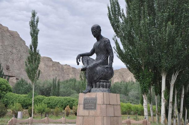 Statue of Kumarajiva in front of the Kizil Caves in Kuqa, Xinjiang province, China.