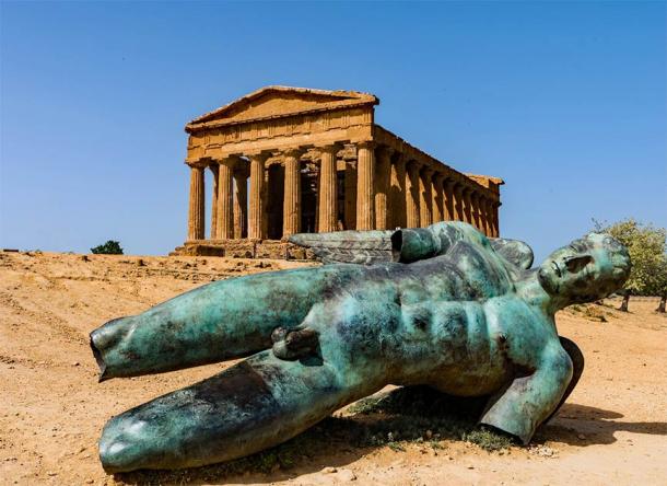 A bronze Greek statue in front of the Concordia Temple in Agrigento's Valley of the Temples, not far from where the statue of Atlas was found lying on the ground. (majonit / Adobe Stock)