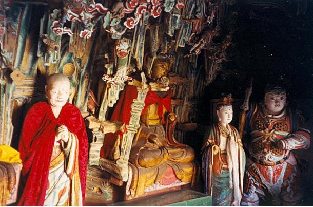 Statues inside the hanging monastery reflect different religious traditions