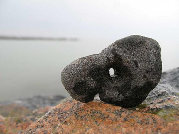 Stone with a hole (hagstone or Adder stone).