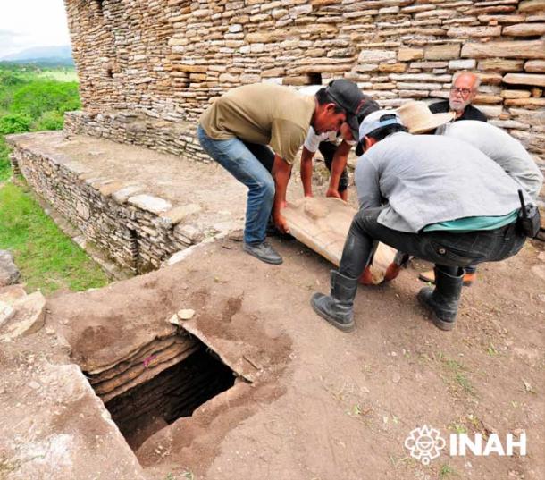 Stone lid was found in 2020 and when removed revealed led to the stacked crypt. (Mauricio Marat / INAH)