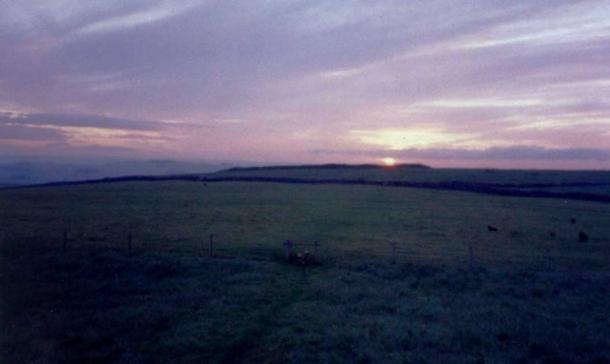 Fig. 6. Summer solstice sunrise over Arbor Low henge as seen from Gibb Hill barrow. (Author Provided)