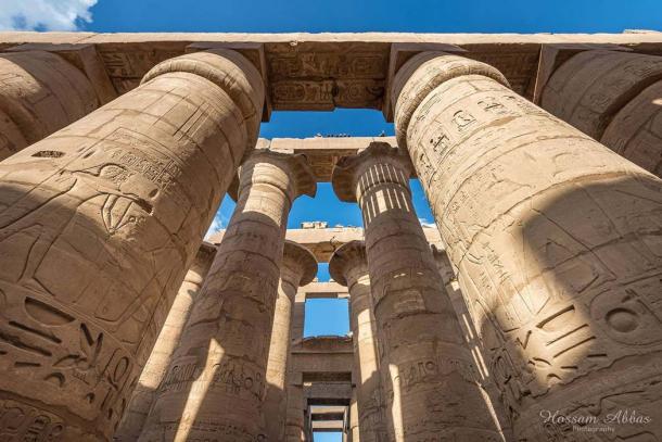 The 134 gigantic columns in the Great Hypostyle Hall at Karnak Temple complex stand testament to a glorious bygone age when it was a pilgrimage spot for over two millennia. A clump of 12 open papyrus capitals here may have been intended to symbolize the primordial ‘mound of creation’. This was the abode of the state god, Amun-Ra. Modern-day Luxor.