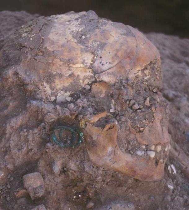 The 3,800-year-old burial of an aristocratic young girl adorned with bronze jewelry and Egyptian scarabs shows century-long links between Jericho and Egypt.