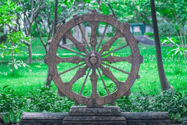 The Dharmachakra sometimes resembles a chariot wheel (TWiRote / Adobe Stock)