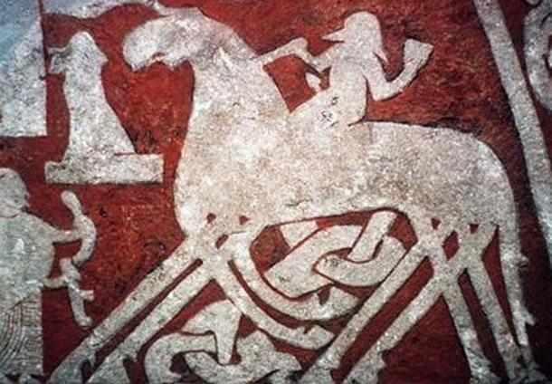 The Norse god Odin on his horse Sleipnir, featured on the Tjängvide image stone in Vallhalla. (Public Domain)