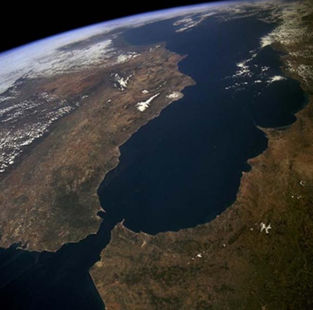 The Straits of Gibraltar seen near the bottom of the photo connects the Mediterranean Sea to the Atlantic Ocean. 