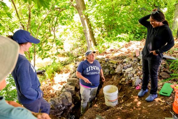 The archeological team from both the University of New Hampshire and Northeastern University at the dig site along the Saugus River. (Matthew Modoono/Northeastern University)