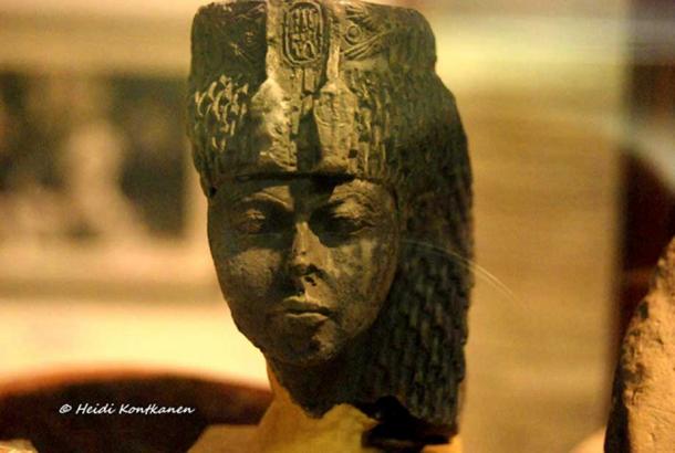 The astute and stern matriarch: Small greenstone head identified as Queen Tiye by her cartouches and distinctive uraei headdress. Found by Flinders Petrie in Sinai in 1904. Egyptian Museum, Cairo.