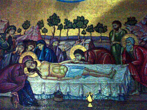 The central part of a mosaic in the Church of the Holy Sepulchre in Jerusalem, on the outer wall of the Catholicon behind the Stone of Unction. The mosaic depicts Jesus being taken down from the cross, and his body being anointed prior to placing in the tomb.