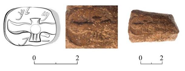The jar handle bearing a ‘lmlk’ stamp impression meaning “belonging to the king” in Hebrew text. (Israel Antiquities Authority)