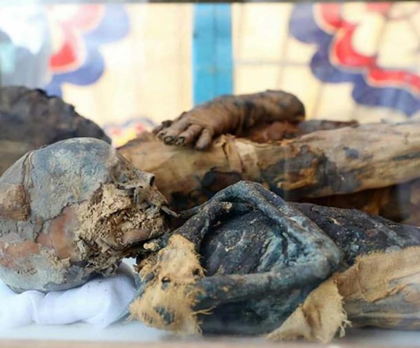 The mummified remains of the woman and boy found in the tomb. Credit: Ministry of Antiquities