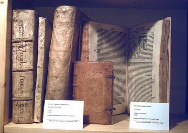 The oldest illustrated version (1513) of the Historia Naturalis of Plinius maior (right). Also showing a 1570 edition of the famous Greek speeches, the Logoi by Demosthenes.