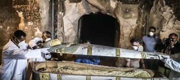 The sarcophagus containing the female mummy being opened. (Youtube Screenshot)