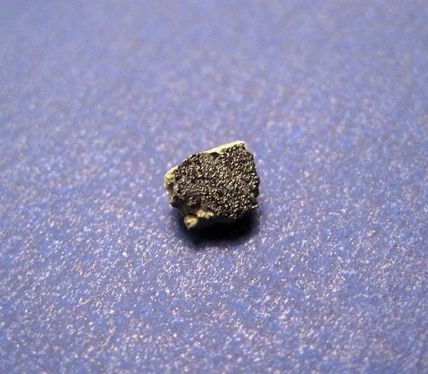 This martian meteorite fell to earth on July 18, 2011 in a valley east of Tata, Morocco. This historic event marks the first witnessed fall of a martian meteorite since Zagami in 1962! Tissint is a shergottite with glossy black fusion crust and a light gray matrix. (Jon Taylor / CC BY-SA 2.0)