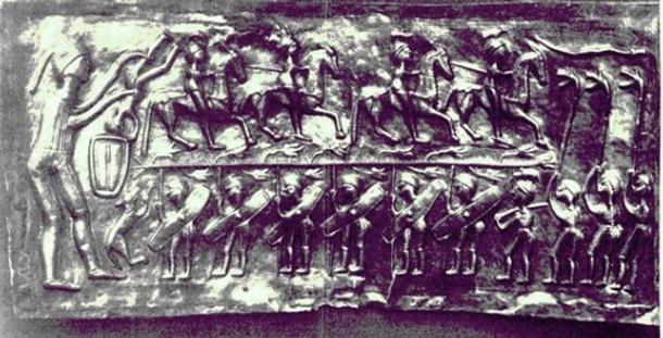 Three carnyx players are depicted at right on plate E of the Gundestrup cauldron. 