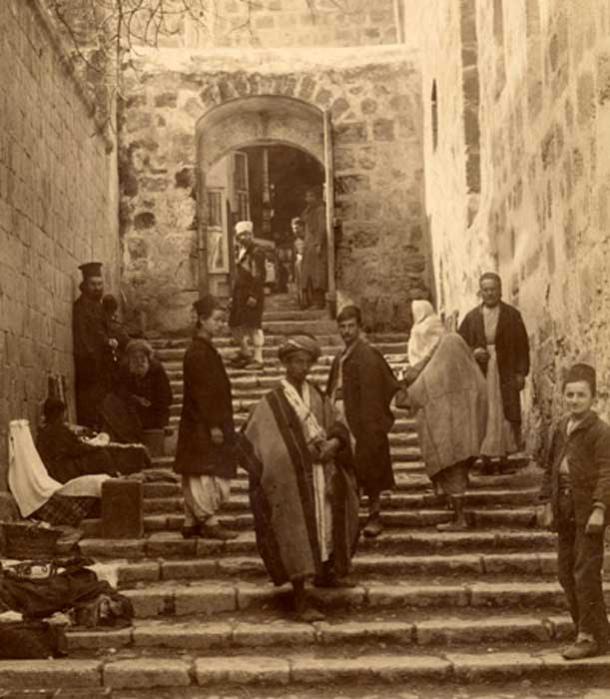Tourists and pilgrims at a side entrance to the Holy Sepulchre, photo by Bonfils, 1870s.