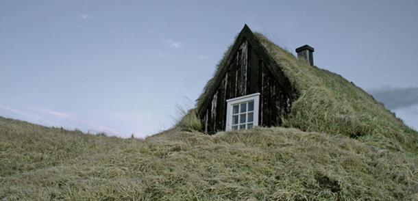 Turf house with a wooden gafli in Iceland.