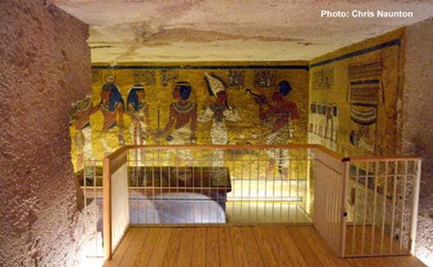 Tutankhamun’s burial chamber, looking in from the Antechamber. Straight ahead, the north wall shows various funerary scenes involving the deceased pharaoh. The modest size of KV62 and its sparse and hurried decoration have for long baffled Egyptologists.