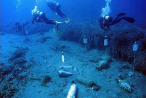 Underwater archaeologists and some of the other artifacts found at the site.