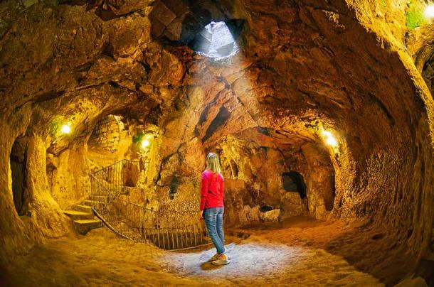 Visitor at the Derinkuyu underground city in Turkey. (natalia_maroz / Adobe Stock)